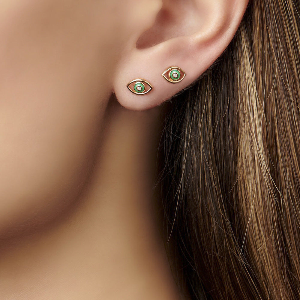 Channel mystery, style, and protection with our Diamond Devil's Eye Stud Earrings – a bold European