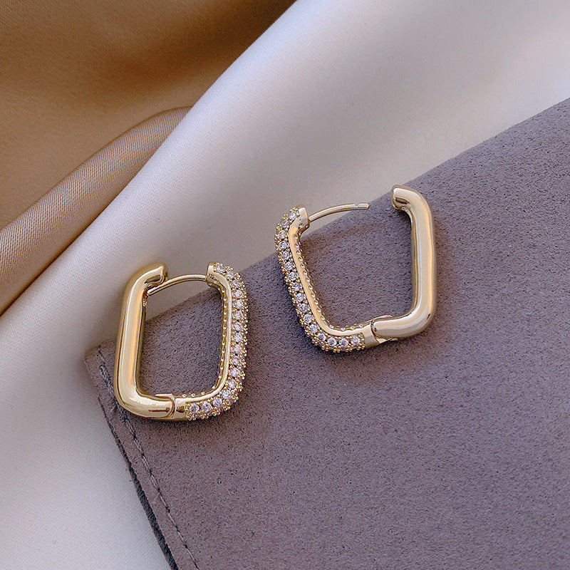 Elevate your everyday style with these Geometric Square Zircon Earrings, inspired by minimalism and modern elegance. With a subtle sparkle from zircon stones and a refined square shape, these earrings are the perfect blend of Korean-Japanese fashion and timeless design.