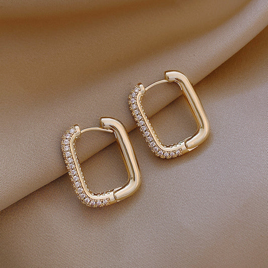Elevate your everyday style with these Geometric Square Zircon Earrings, inspired by minimalism and modern elegance. With a subtle sparkle from zircon stones and a refined square shape, these earrings are the perfect blend of Korean-Japanese fashion and timeless design.