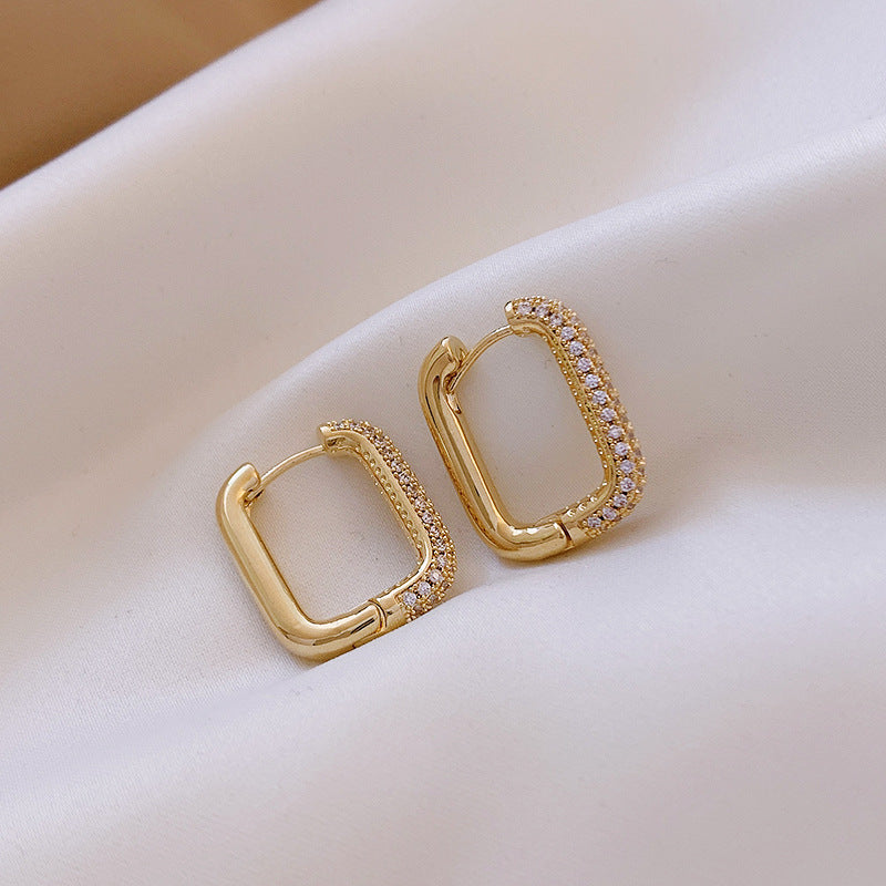 Elevate your everyday style with these Geometric Square Zircon Earrings, inspired by minimalism and modern elegance. With a subtle sparkle from zircon stones and a refined square shape, these earrings are the perfect blend of Korean-Japanese fashion and timeless design.