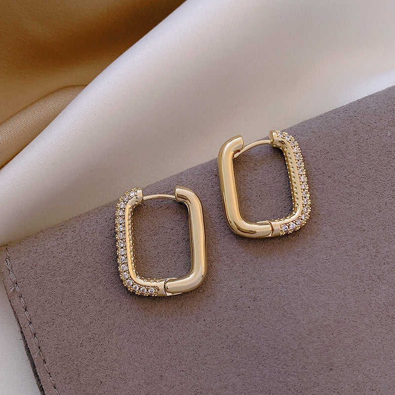 Elevate your everyday style with these Geometric Square Zircon Earrings, inspired by minimalism and modern elegance. With a subtle sparkle from zircon stones and a refined square shape, these earrings are the perfect blend of Korean-Japanese fashion and timeless design.